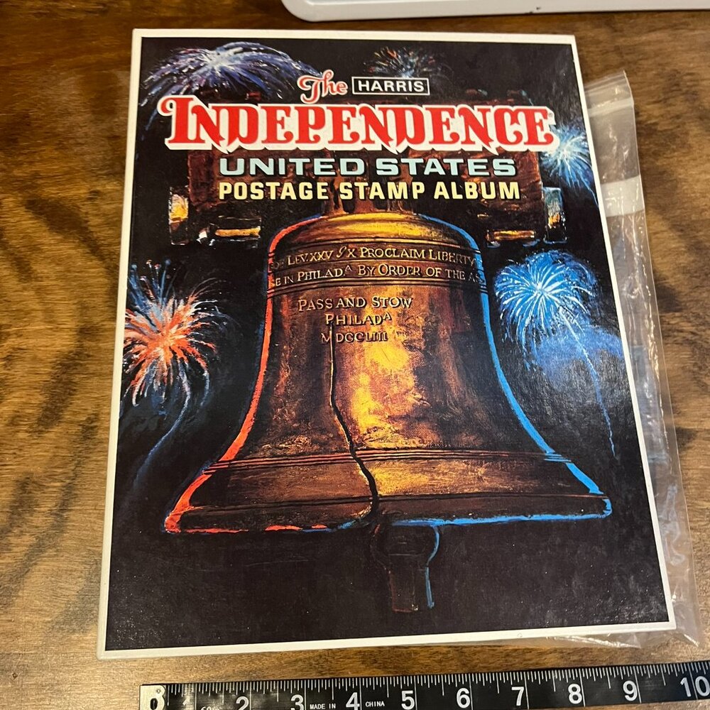 The Harris independence United States postage stamp album with several stamps !